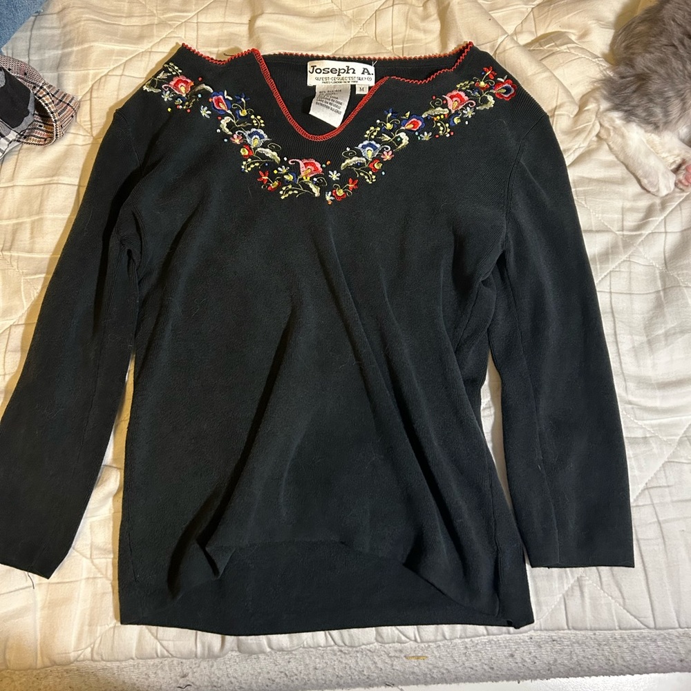 woman’s shirt with floral neckline